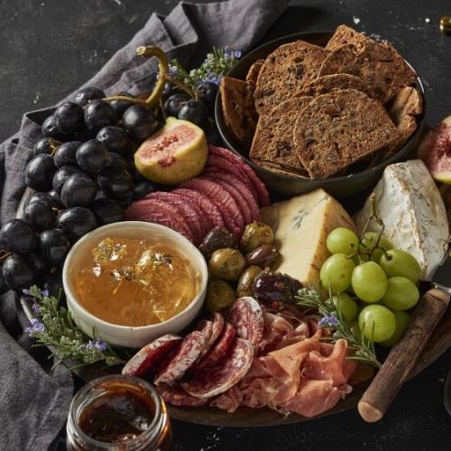 The Gourmet Merchant fruit pastes on lush cheese and charcuterie platter.