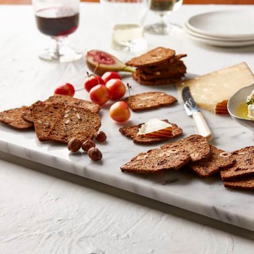 Fruit and seed crispbreads on marble cheese platter by The Gourmet Merchant