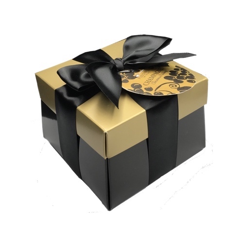 champagne christmas pudding in blsck gift box with gold top and ribbon